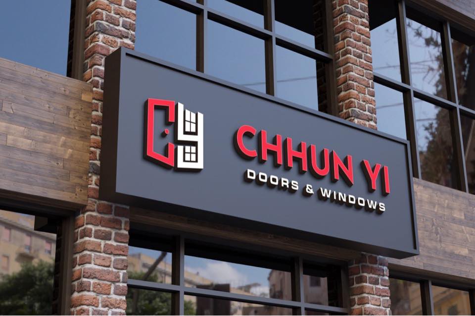 Chhun Yi Doors & Windows sign on a brick building