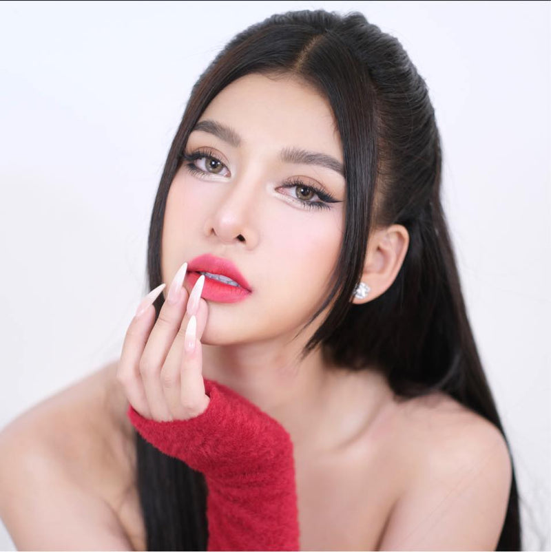 Woman with red lipstick and a red sleeve on a white background