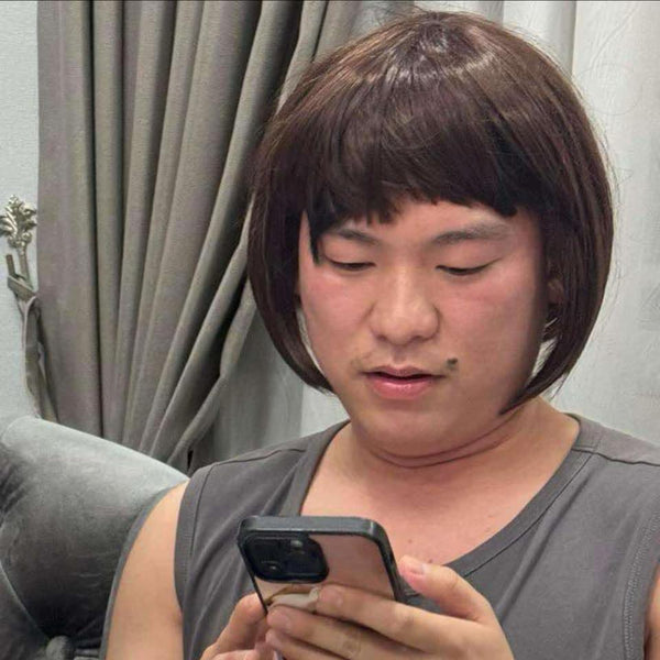 Person using a smartphone with a neutral background