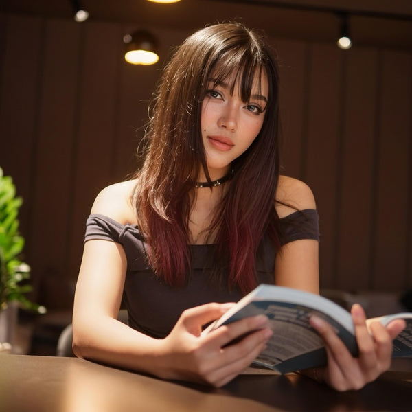 Woman reading a book in a cozy indoor setting