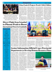 Newspaper page with various articles and images, including a photo of people sitting on a bench with flags in the background.