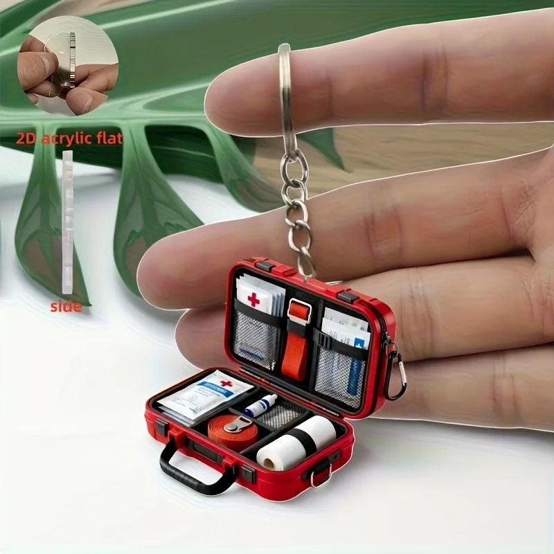 1pc 2D Flat Proportional First Aid Kit Keychain,Compact and Portable Care with CPR Guide Symbols,Bandage and Patch Compatible.