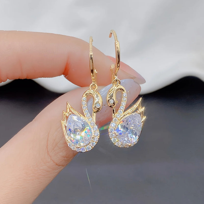 1 Pair of Luxurious Golden-Tone Swan Dangle Earrings with Sparkling Rhinestones - Elegant Zinc Alloy Fashion Jewelry for Women