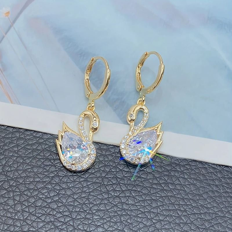 1 Pair of Luxurious Golden-Tone Swan Dangle Earrings with Sparkling Rhinestones - Elegant Zinc Alloy Fashion Jewelry for Women