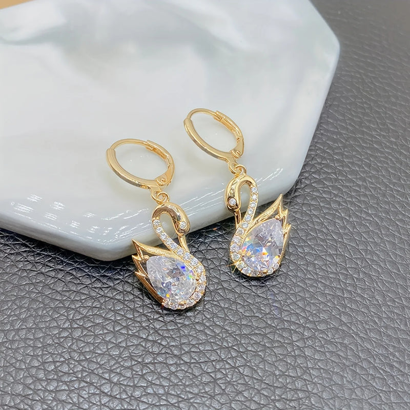 1 Pair of Luxurious Golden-Tone Swan Dangle Earrings with Sparkling Rhinestones - Elegant Zinc Alloy Fashion Jewelry for Women
