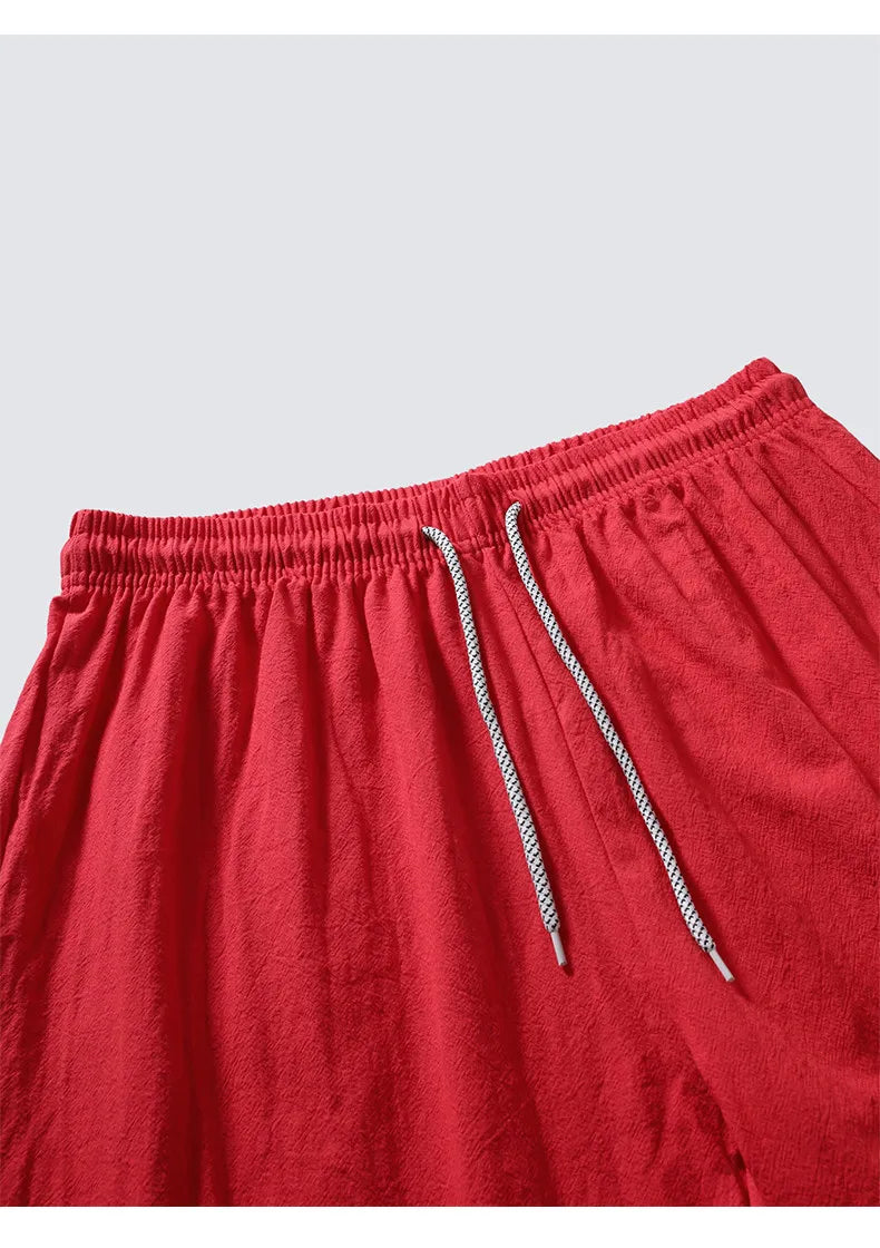 Men's Red Embroidered Two-piece Set for Summer, Featuring A Chinese-style Short-sleeve Shirt Paired with Ankle-length Pants.