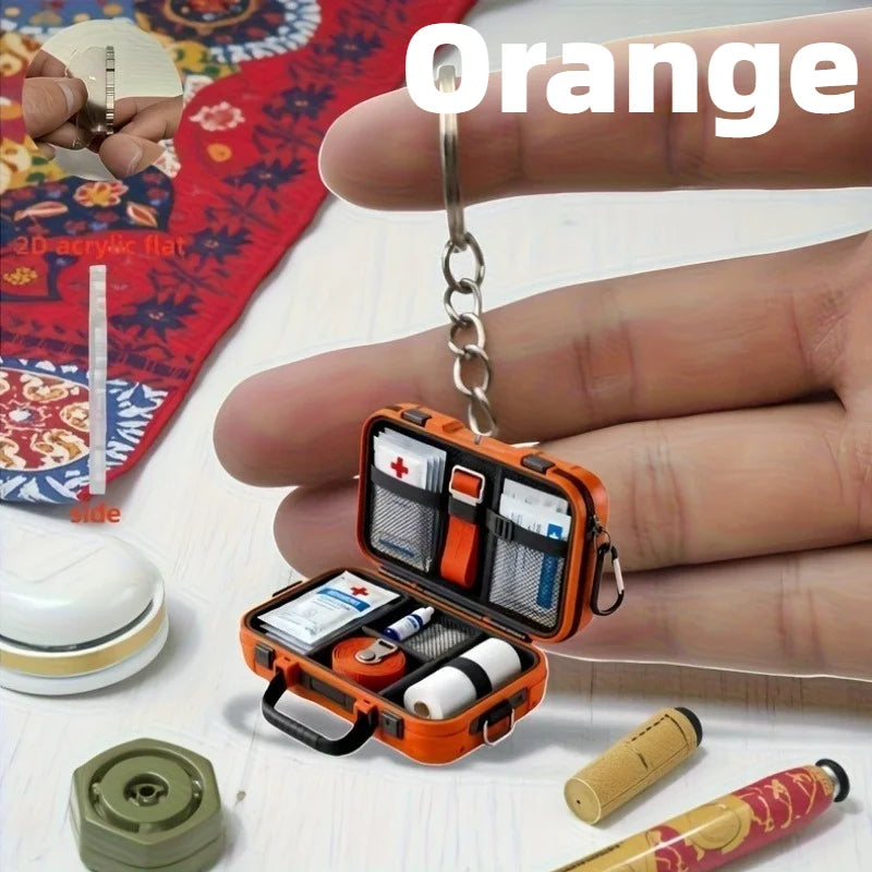 1pc 2D Flat Proportional First Aid Kit Keychain,Compact and Portable Care with CPR Guide Symbols,Bandage and Patch Compatible.