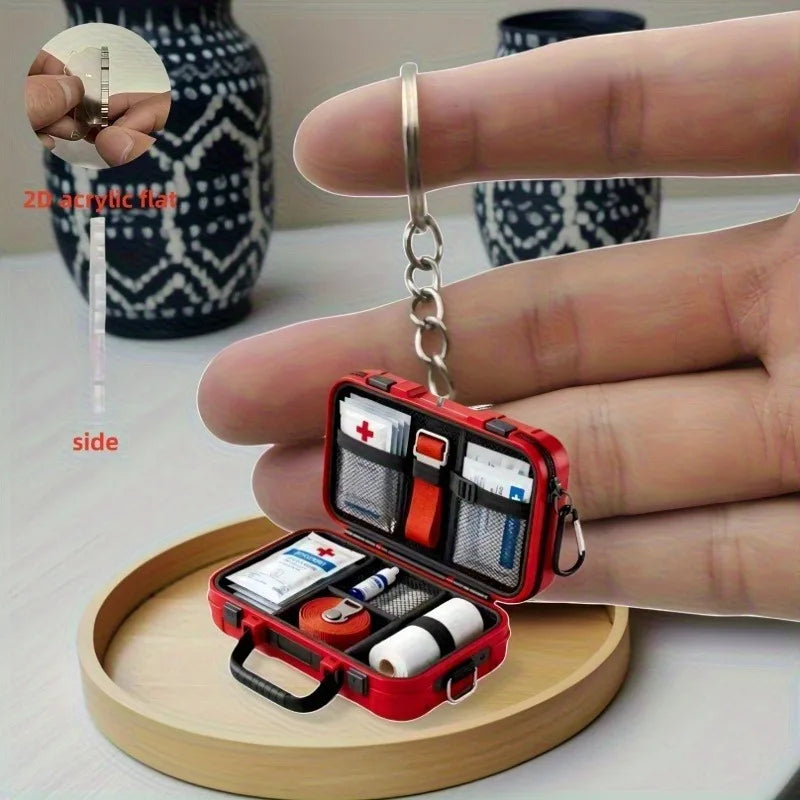 1pc 2D Flat Proportional First Aid Kit Keychain,Compact and Portable Care with CPR Guide Symbols,Bandage and Patch Compatible.