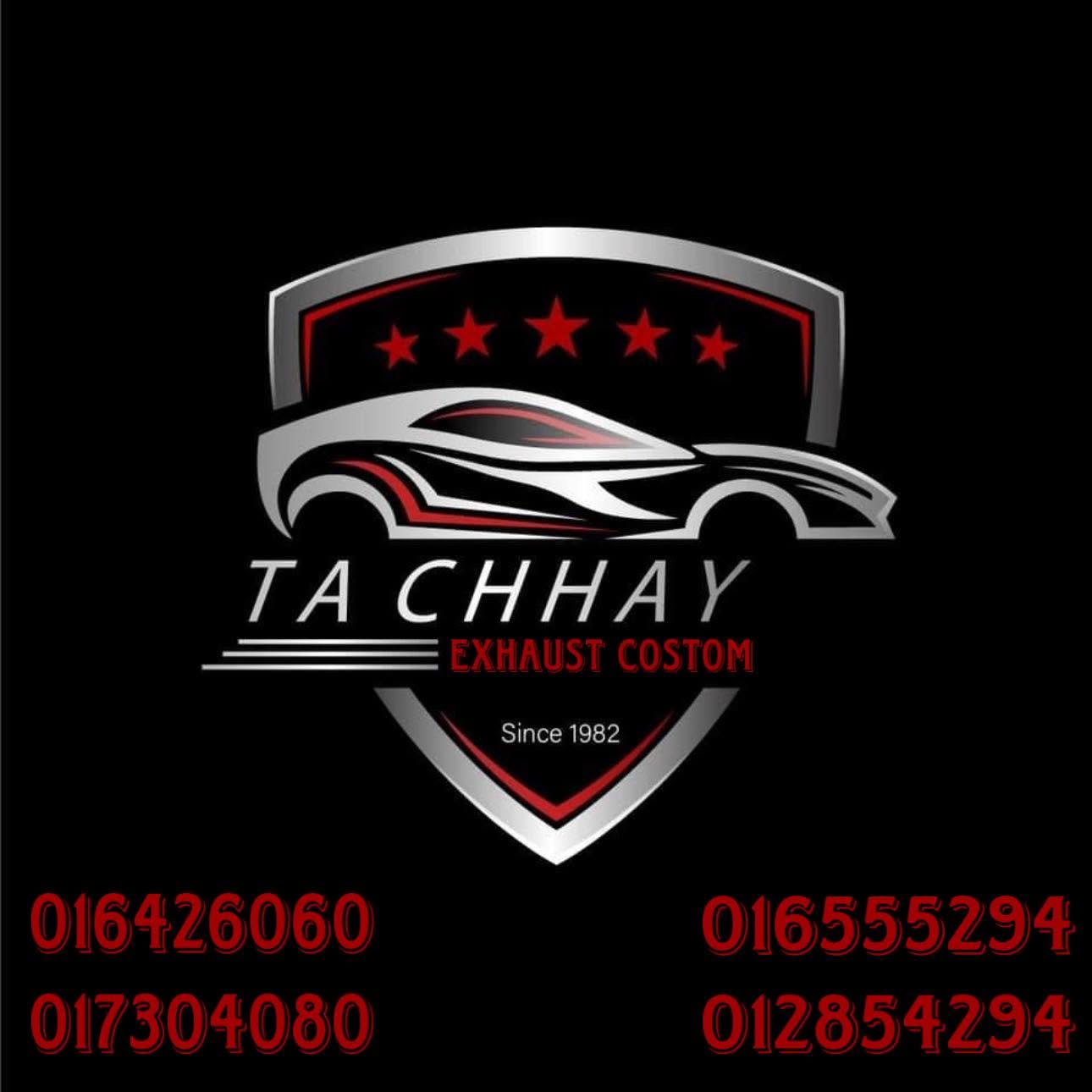 A black square graphic featuring a metallic shield logo with a stylized silver car silhouette, red stars, and the text 'TA CHHAY' and 'EXHAUST CUSTOM' on a black background, with four red phone numbers arranged below.